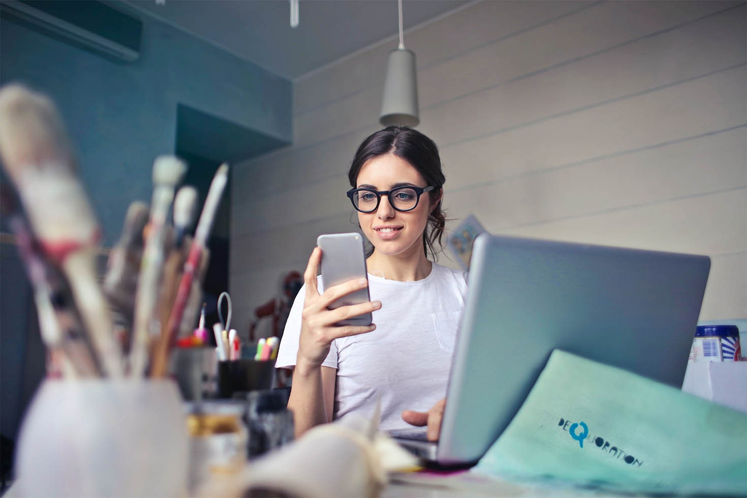 Woman on her phone while at work